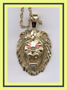 gold lion charm with ruby eyes